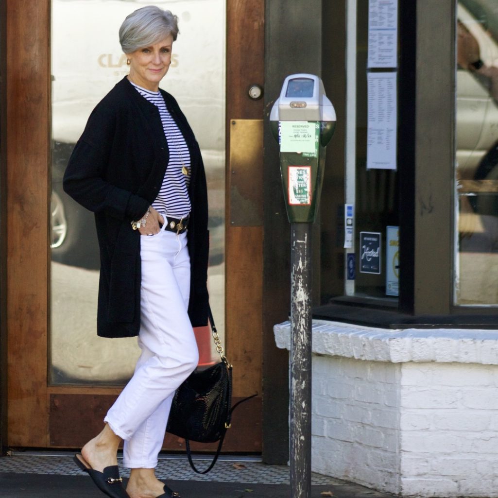 black cardigan, white denim, black mules