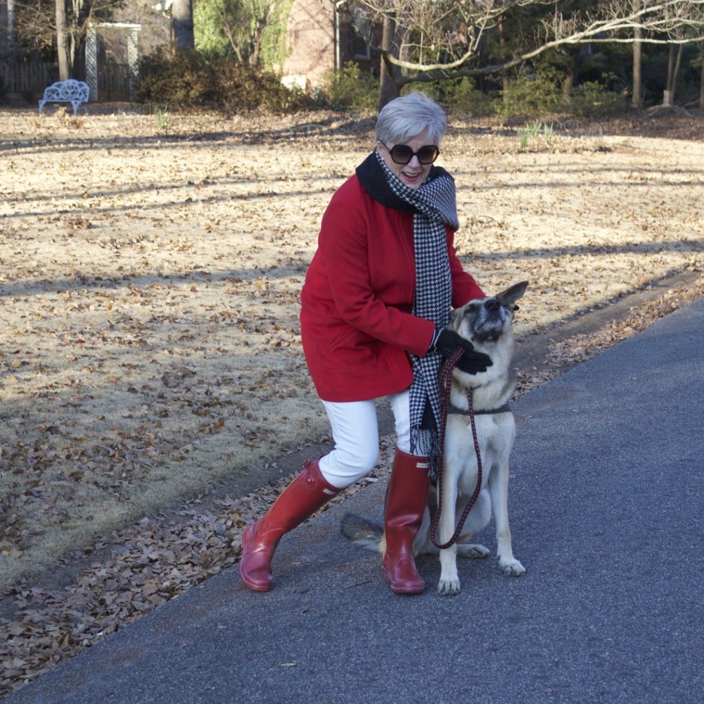 red stadium coat, striped crewneck, white denim, red hunter boots, houndstooth cashmere scarf