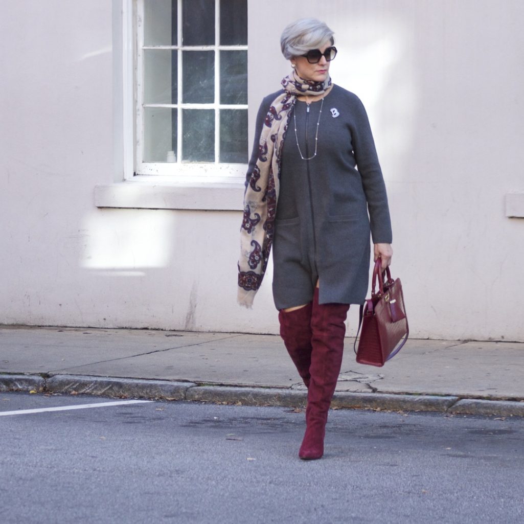 burgundy boots and statement handbag