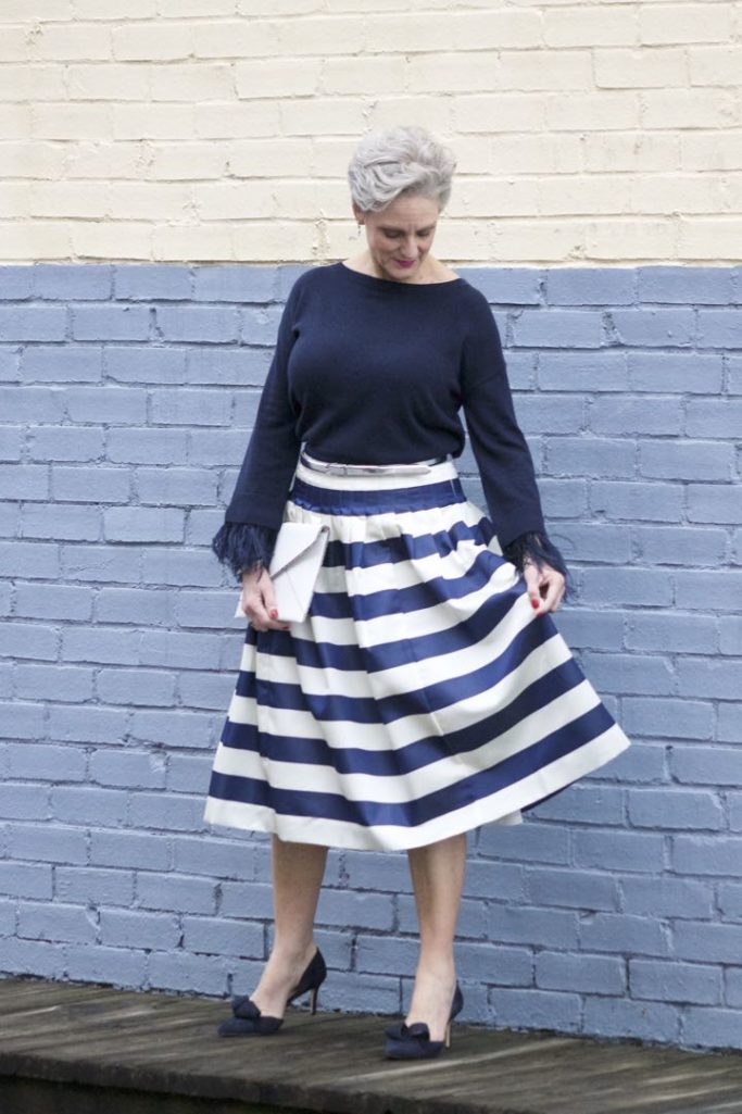 j.crew feather sleeve crewneck sweater, j.crew pleated satin stripe skirt, nine west suede pumps, rebecca minkoff leo envelope clutch