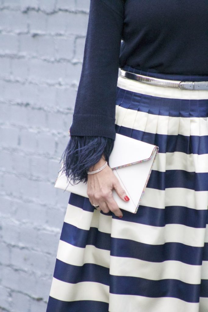 j.crew feather sleeve crewneck sweater, j.crew pleated satin stripe skirt, nine west suede pumps, rebecca minkoff leo envelope clutch
