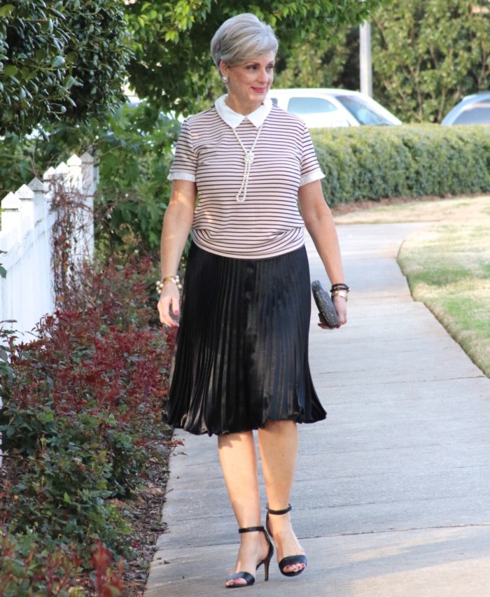karl lagerfeld striped blouse black pleated skirt, black sandals, clutch