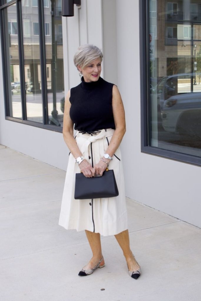 pleated cone denim skirt, black sleeveless turtleneck,