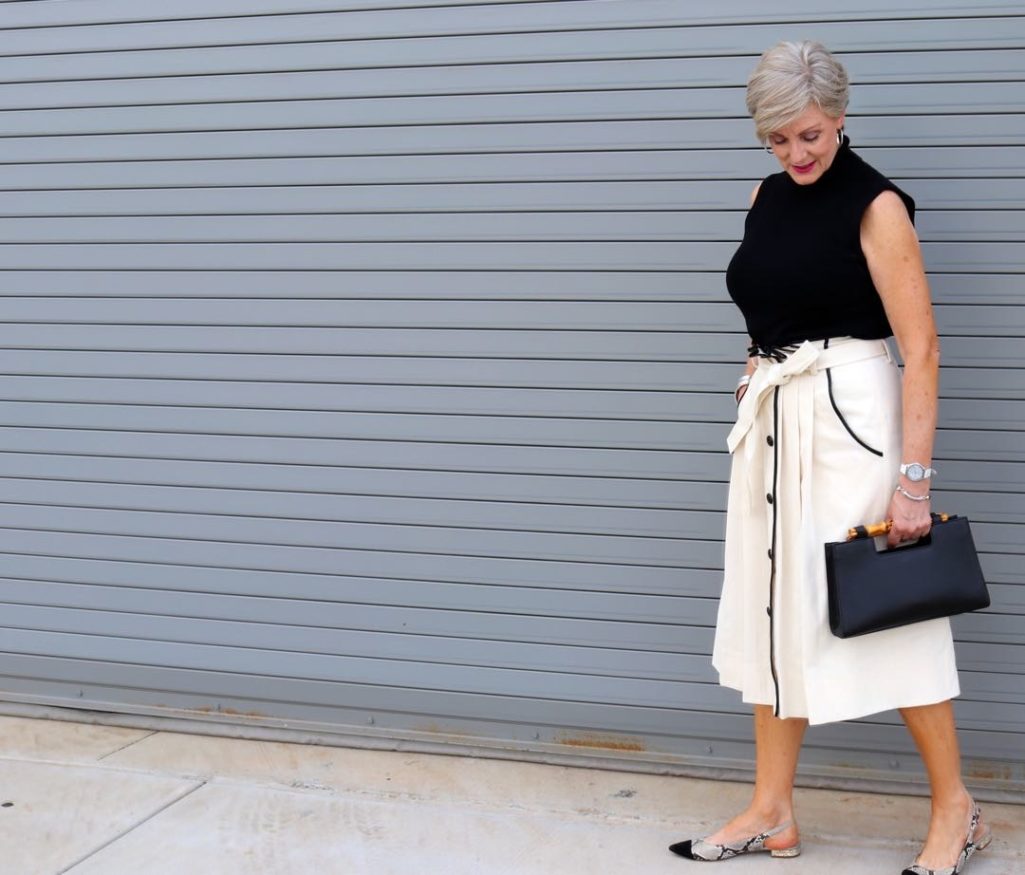 pleated cone denim skirt, black sleeveless turtleneck,