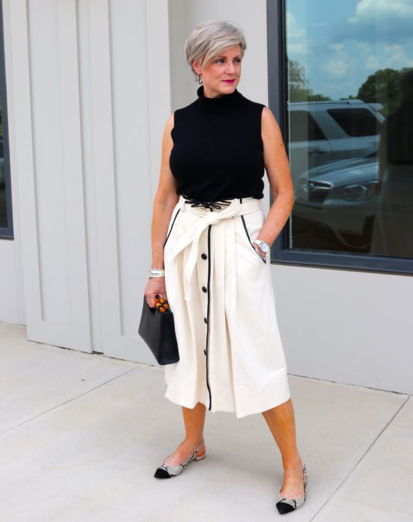 pleated cone denim skirt, black sleeveless turtleneck,