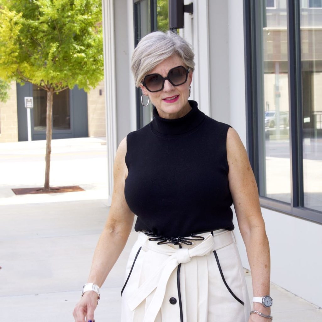 pleated cone denim skirt, black sleeveless turtleneck,