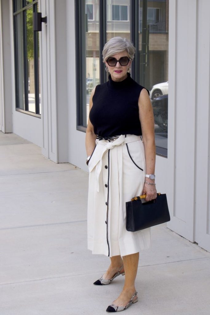 pleated cone denim skirt, black sleeveless turtleneck,