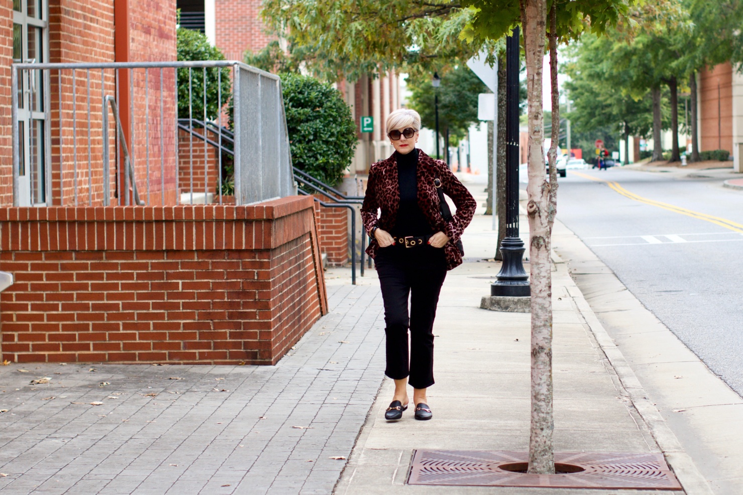 beth at Style at a Certain Age wears a J.Crew leopard blazer, cropped black jeans, Ralph Lauren turtleneck and Gucci dupes