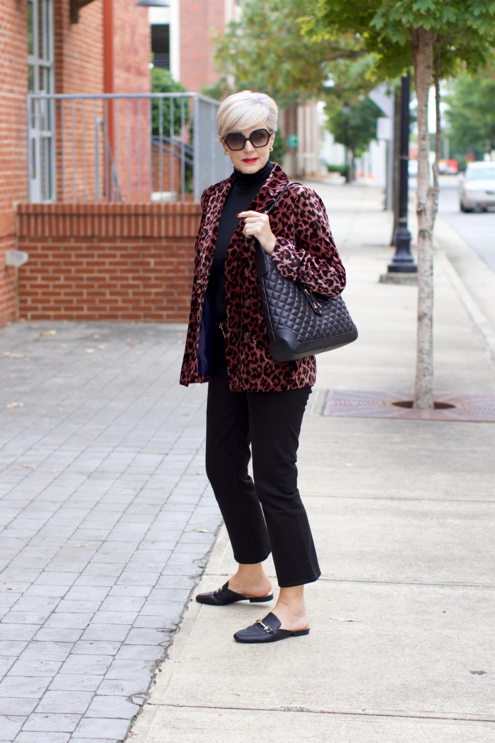 beth at Style at a Certain Age wears a J.Crew leopard blazer, cropped black jeans, Ralph Lauren turtleneck and Gucci dupes