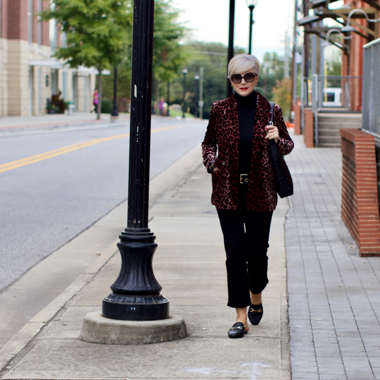 beth at Style at a Certain Age wears a J.Crew leopard blazer, cropped black jeans, Ralph Lauren turtleneck and Gucci dupes