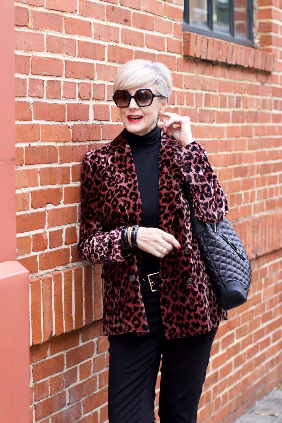 beth at Style at a Certain Age wears a J.Crew leopard blazer, cropped black jeans, Ralph Lauren turtleneck and Gucci dupes