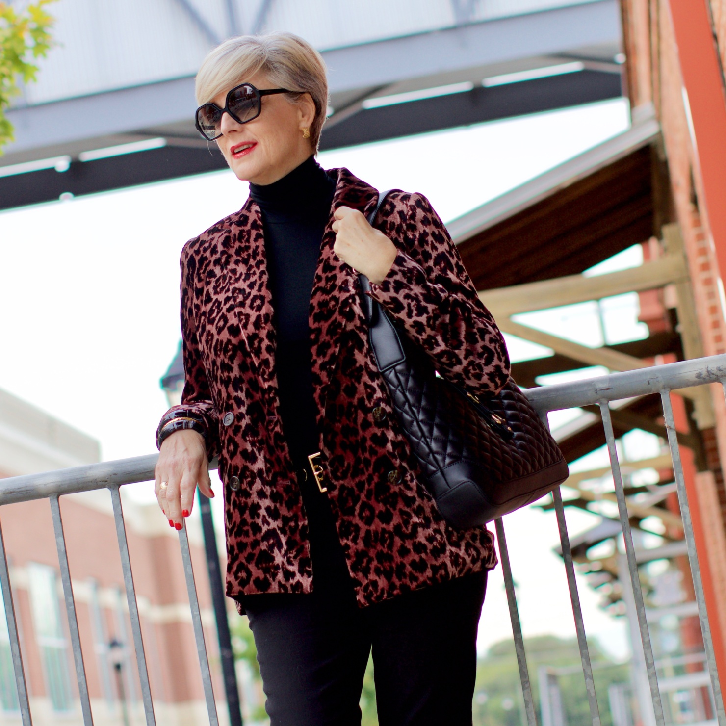 beth at Style at a Certain Age wears a J.Crew leopard blazer, cropped black jeans, Ralph Lauren turtleneck and Gucci dupes