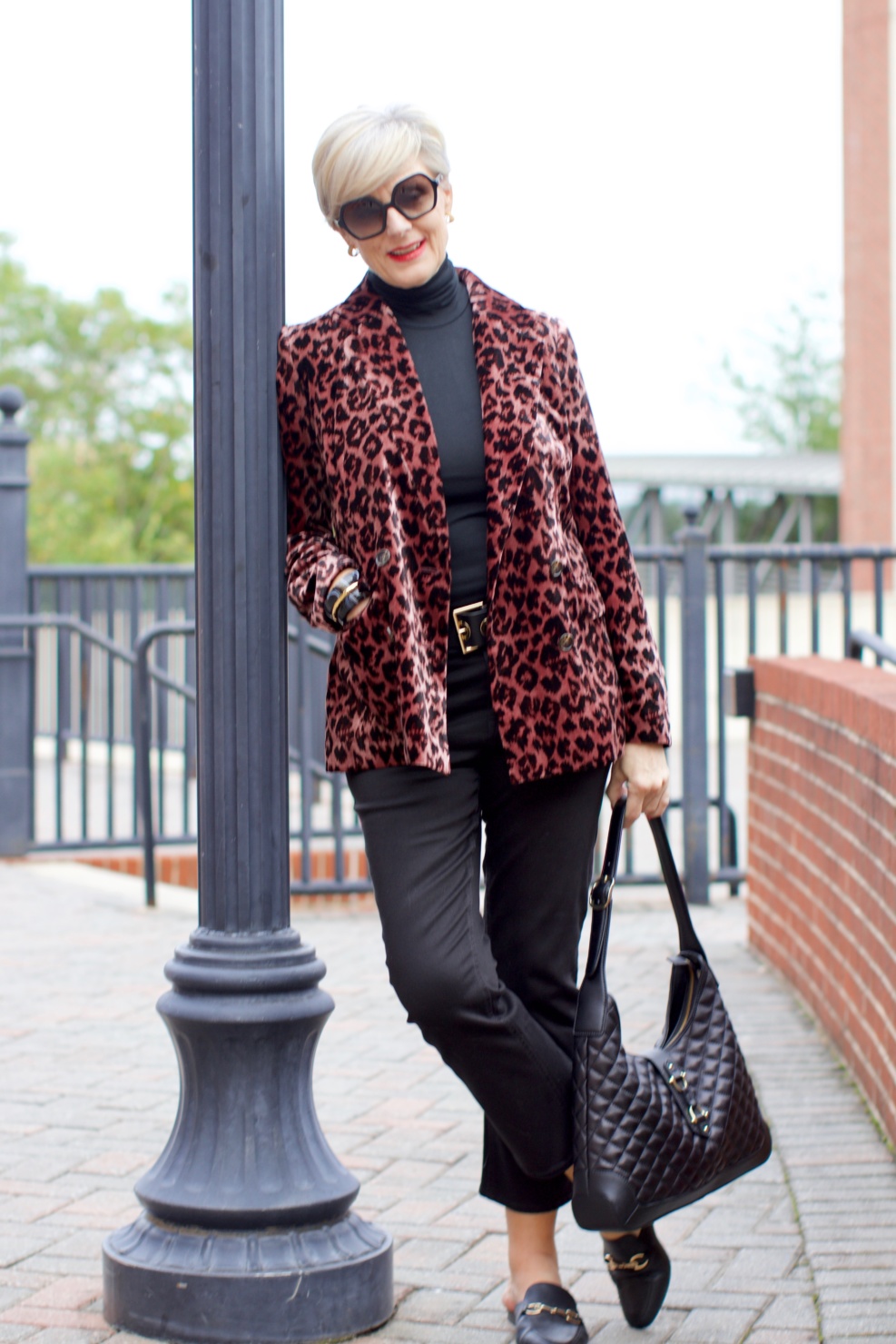 beth at Style at a Certain Age wears a J.Crew leopard blazer, cropped black jeans, Ralph Lauren turtleneck and Gucci dupes