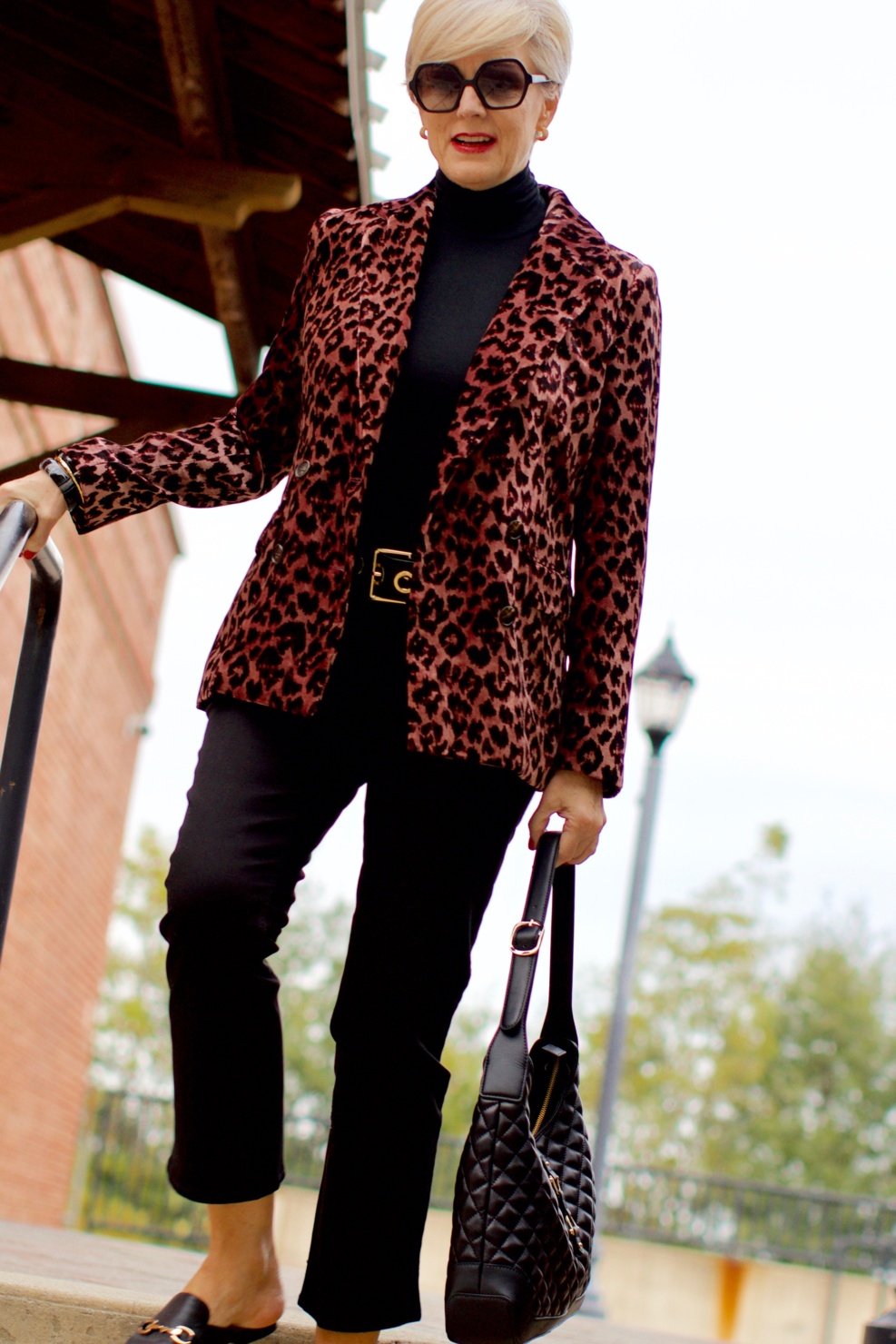 beth at Style at a Certain Age wears a J.Crew leopard blazer, cropped black jeans, Ralph Lauren turtleneck and Gucci dupes
