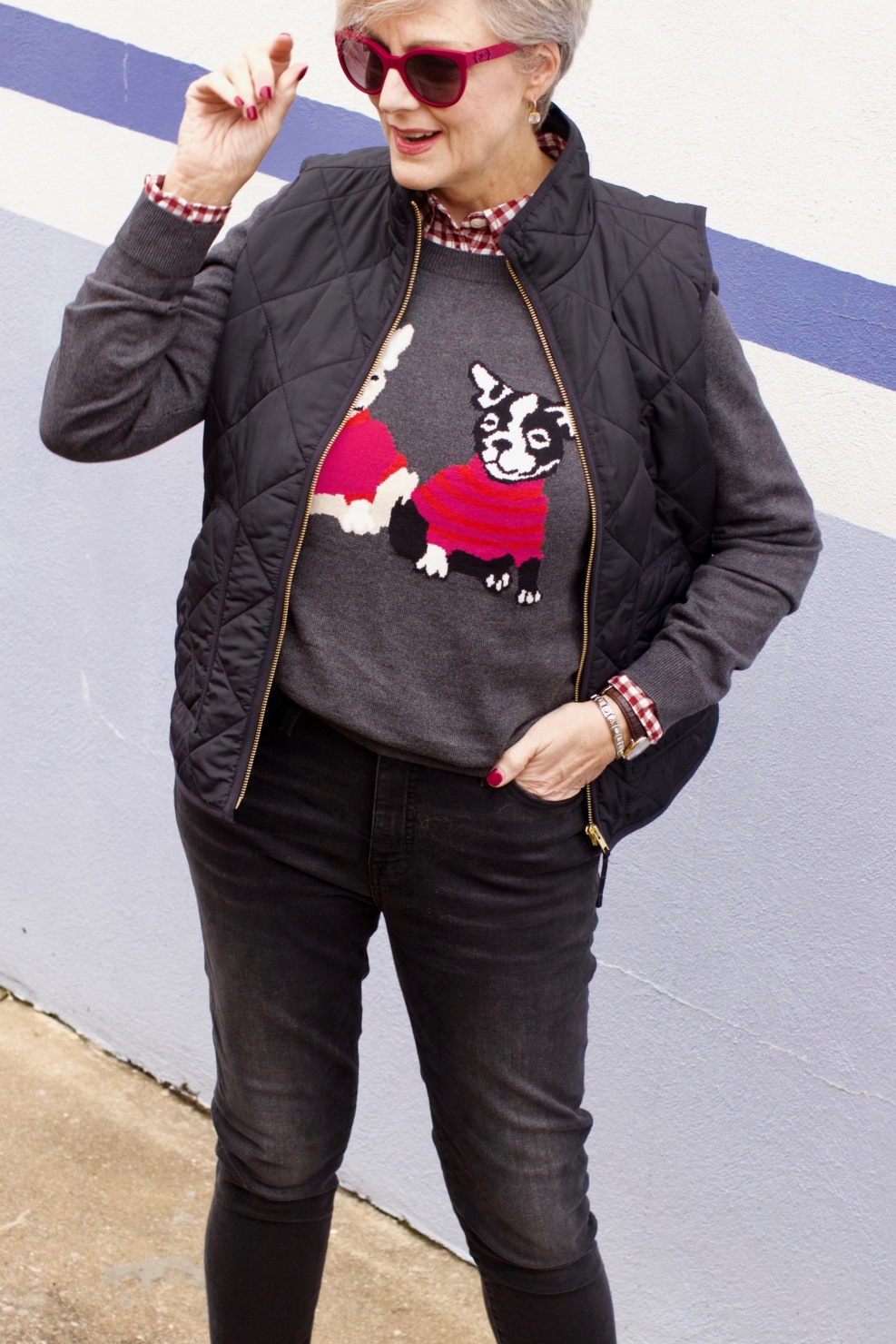 beth from Style at a Certain Age wears a J.Crew Factory high rise skinny jean, burgundy check shirt, french bulldog teddie sweater, quilted puffer jacket