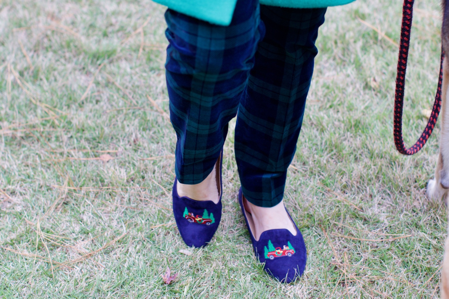 beth from Style at a Certain age wears velveteen black watch plaid pants, blue ribbed turtleneck, and loafers