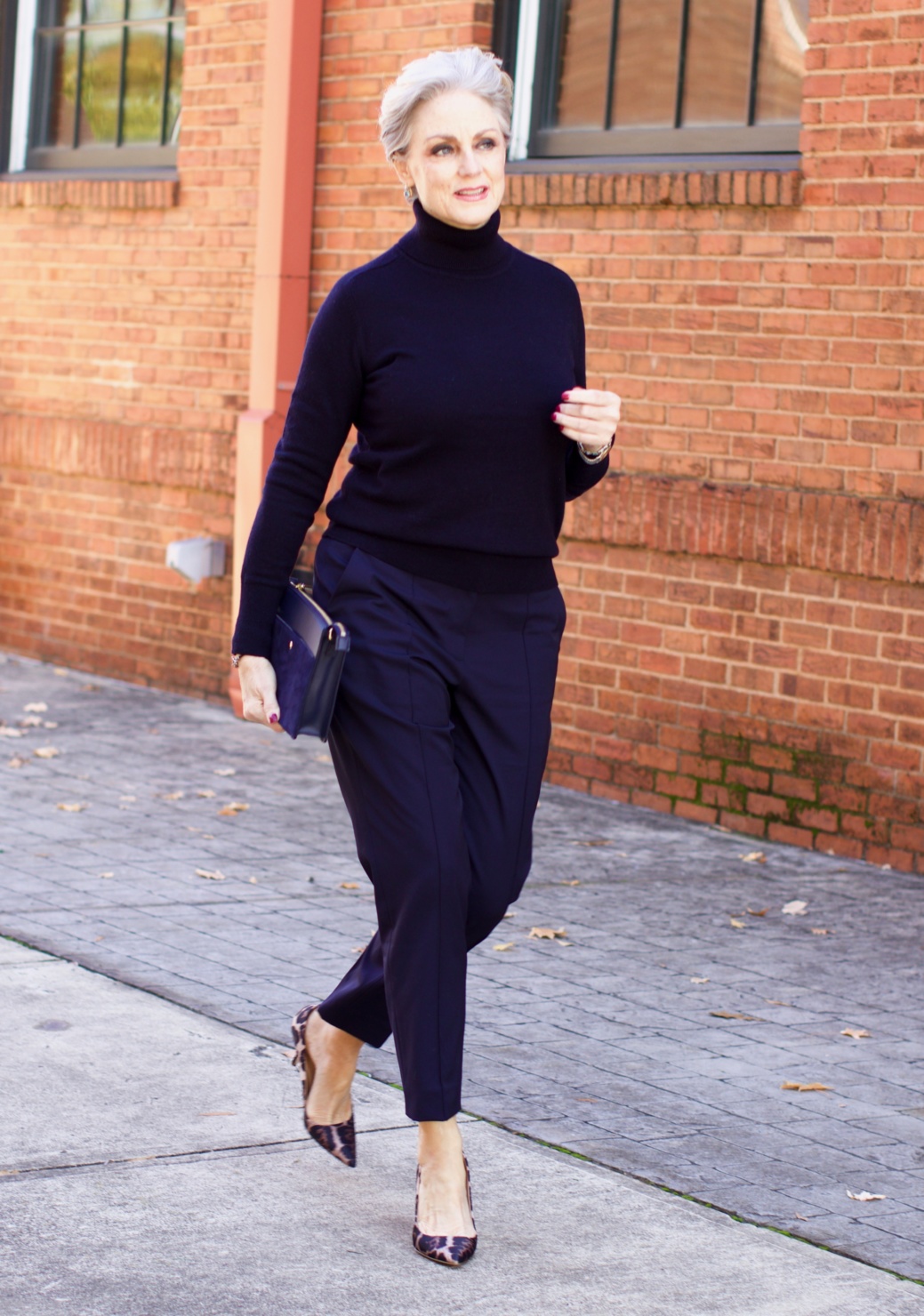 beth from Style at a Certain Age wears an Everlane cashmere turtleneck, Italian weave ankle pants, leopard pumps, and Talbots green overcoat