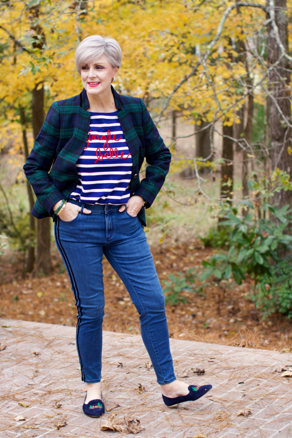 beth from Style at a Certain age wears velveteen black watch plaid pants, blue ribbed turtleneck, and loafers