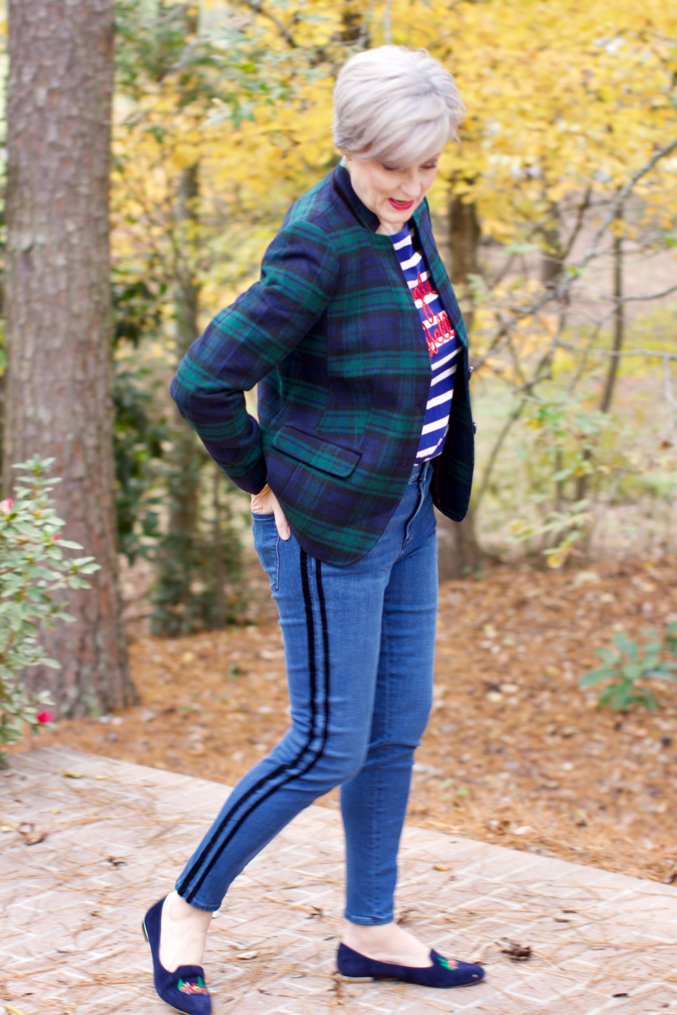 beth from Style at a Certain age wears velveteen black watch plaid pants, blue ribbed turtleneck, and loafers