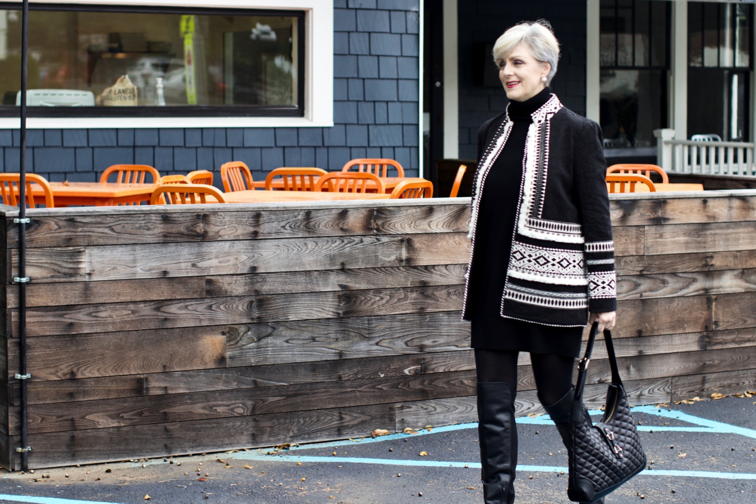 beth from style at a certain age wears a monochromatic outfit cashmere sweater dress from everlane, anthropologie embroidered jacket, black over the knee boots