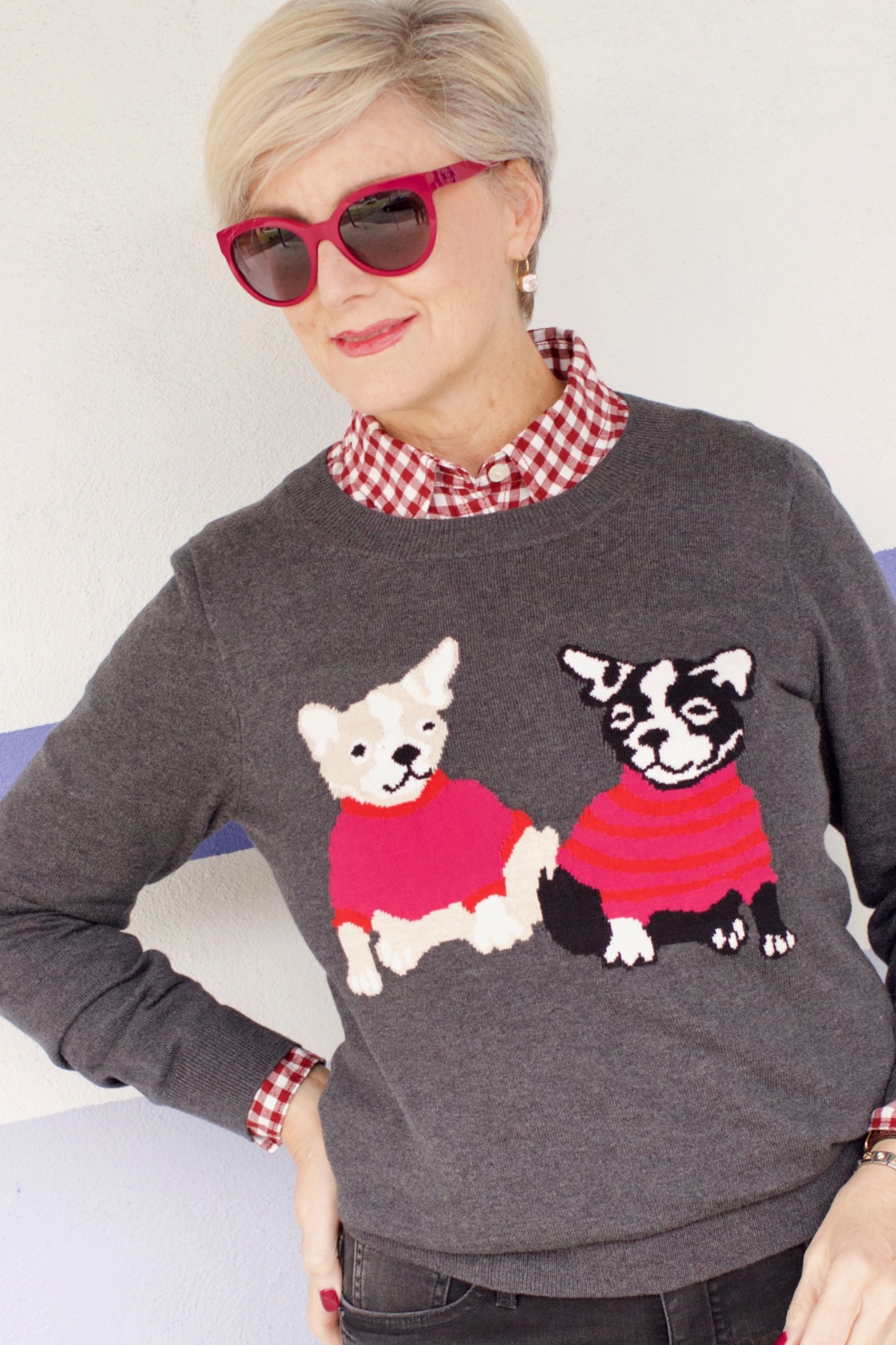 beth from Style at a Certain Age wears a J.Crew Factory high rise skinny jean, burgundy check shirt, french bulldog teddie sweater, quilted puffer jacket