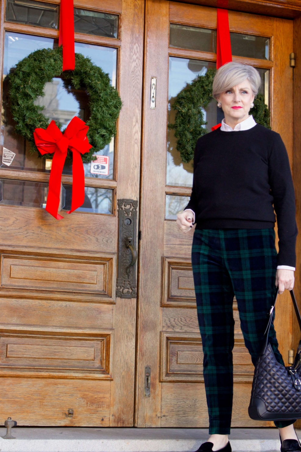Christmas in the City - beth from Style at a Certain Age wears Talbots black watch plaid ankle pants, Everlane black cashmere crewneck, and Talbots navy puffer jacket