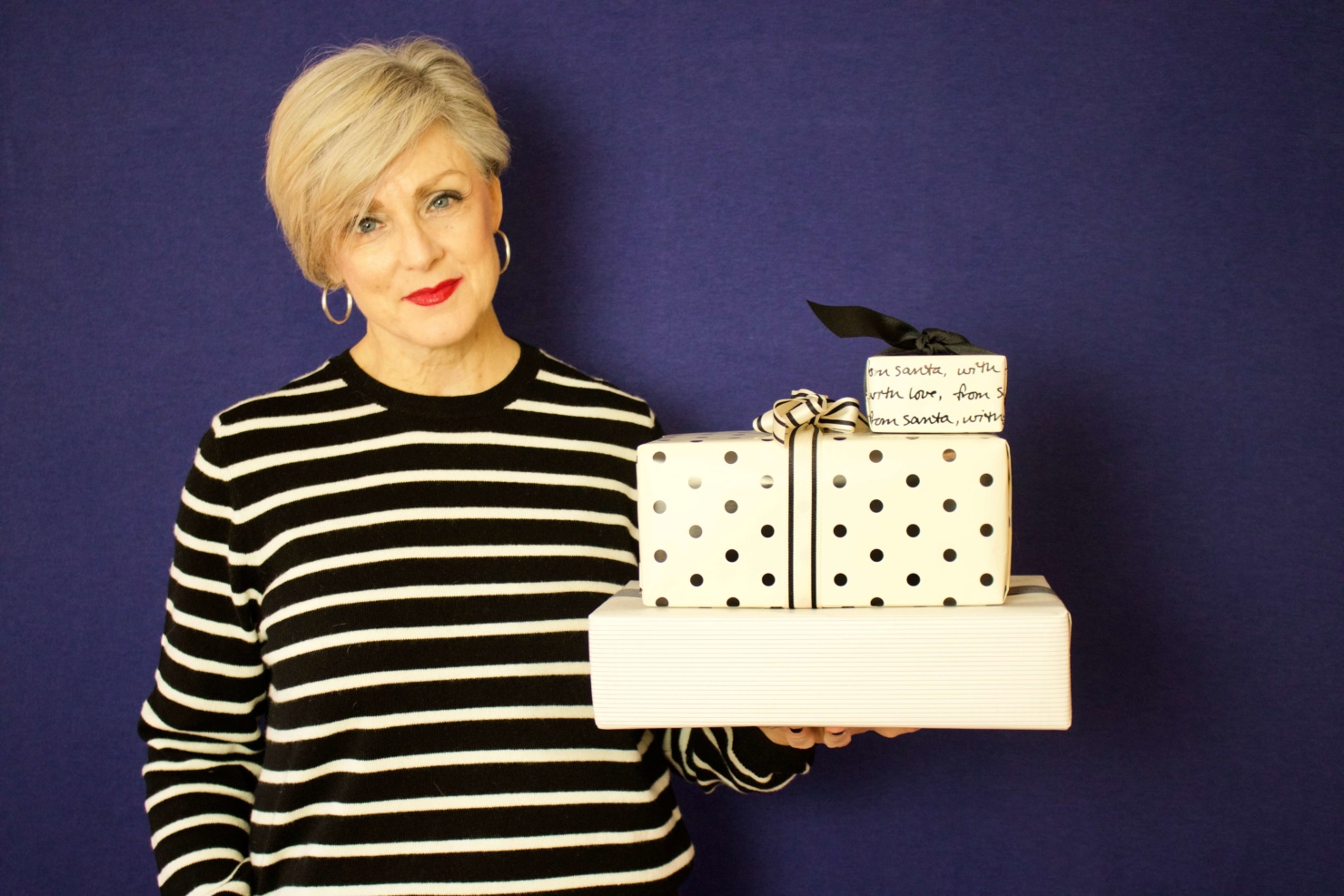 beth from Style at a Certain Age wears a black and white striped cashmere crewneck from Marks & Spencer