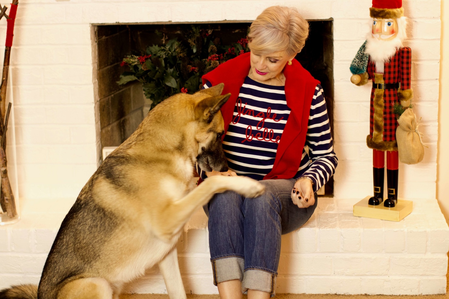 beth from Style at a Certain Age wears a Talbots jingle belle striped tee, J.Crew jeans, and embroidered smoking slippers