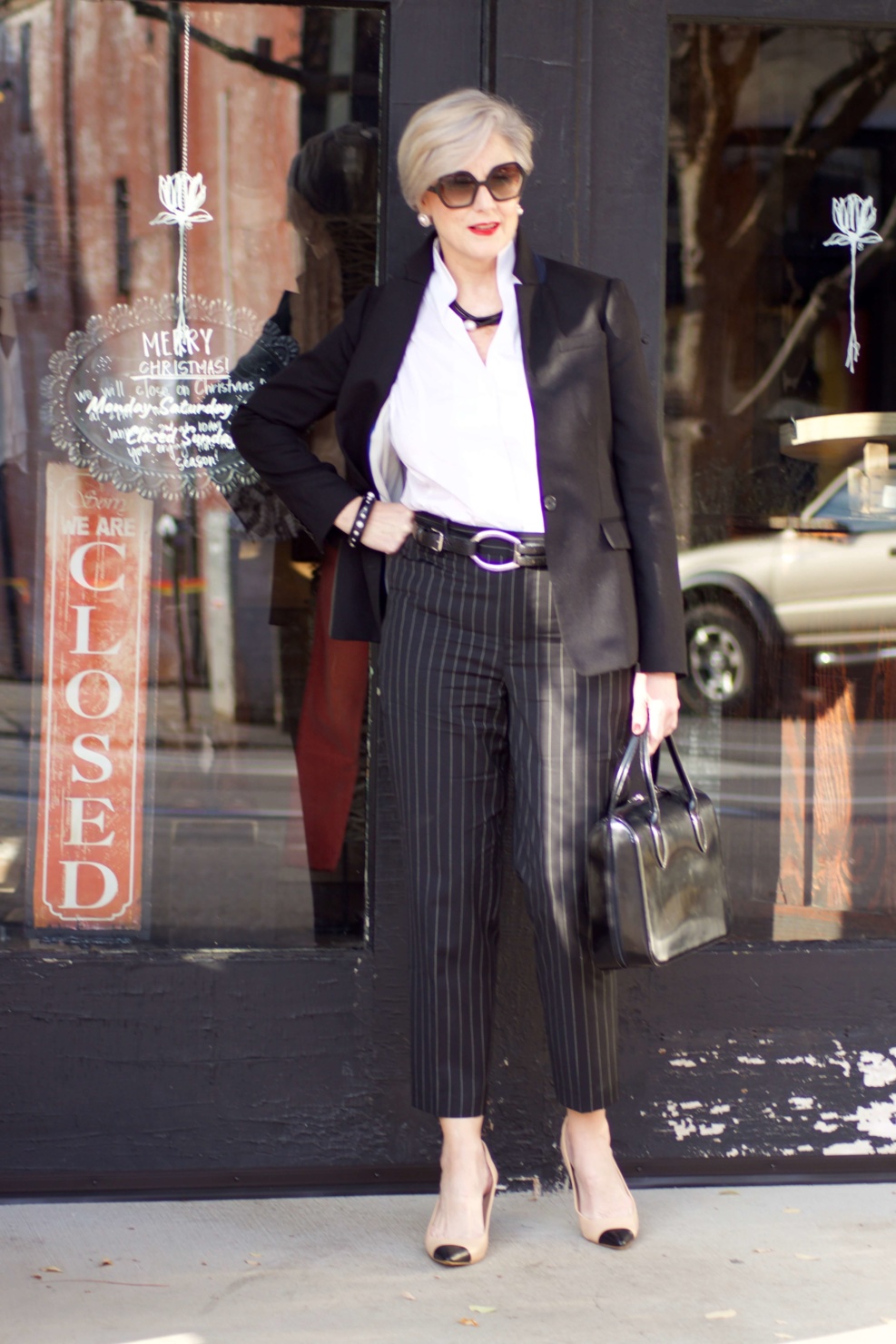 beth from Style at a Certain Age wears Ralph Lauren pinstripe pants, Misook white blouse, J.Crew black blazer, cap toe pumps and black handbag
