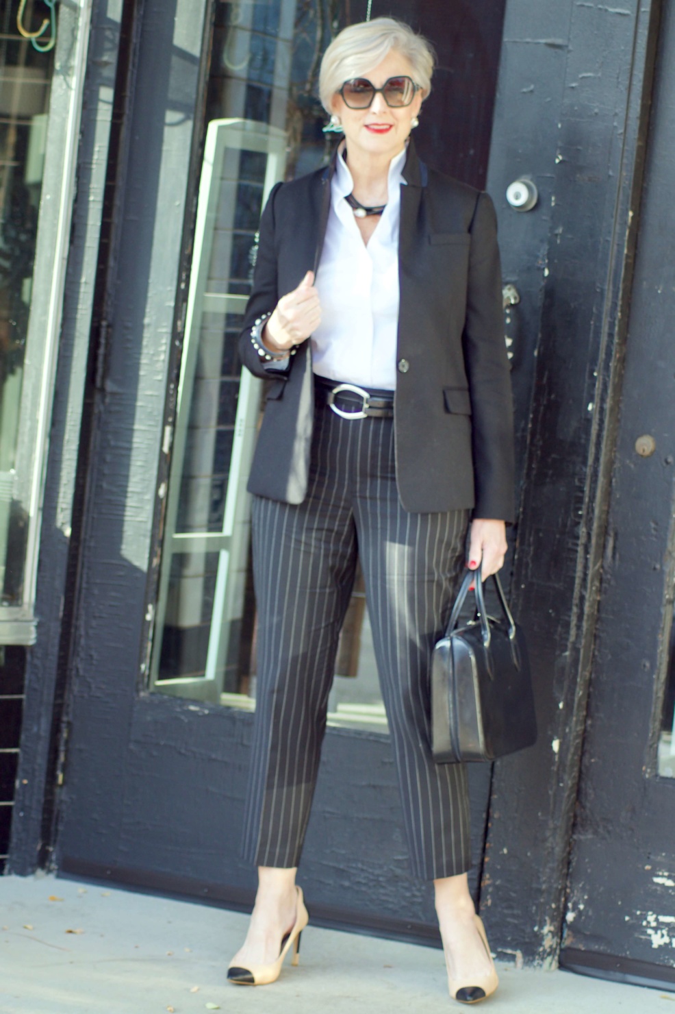 beth from Style at a Certain Age wears Ralph Lauren pinstripe pants, Misook white blouse, J.Crew black blazer, cap toe pumps and black handbag