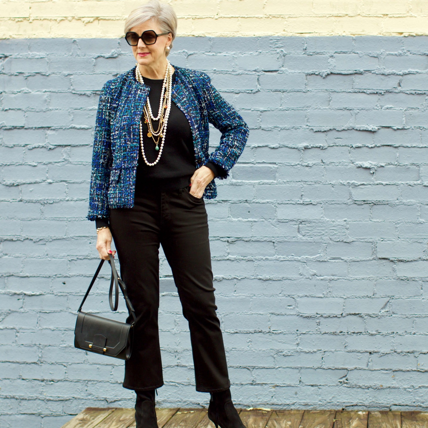 beth at Style at a Certain Age wears an Ann Taylor tweed military jacket, Everlane crewneck cashmere, J.Crew cropped flare denim, pointy-toed boots and strings of pearls