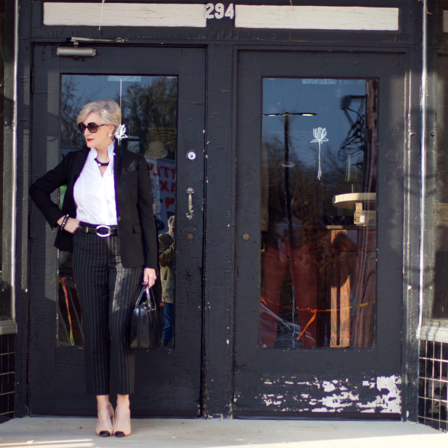 beth from Style at a Certain Age wears Ralph Lauren pinstripe pants, Misook white blouse, J.Crew black blazer, cap toe pumps and black handbag