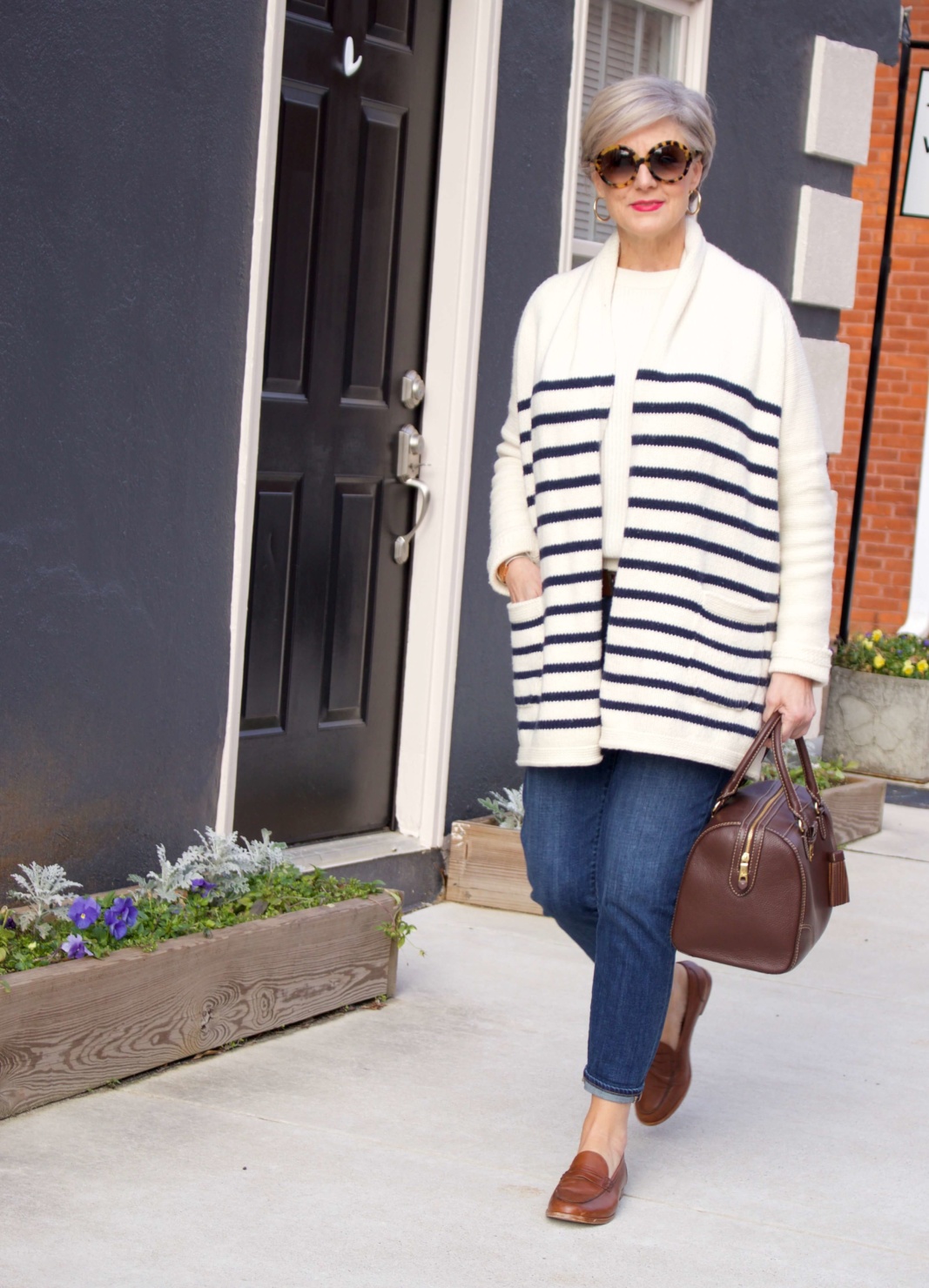 beth from Style at a Certain Age wears a J.Crew cozy striped cardigan, Everlane cashmere crewneck, Talbots girlfriend jeans, J.Crew Ryan loafers