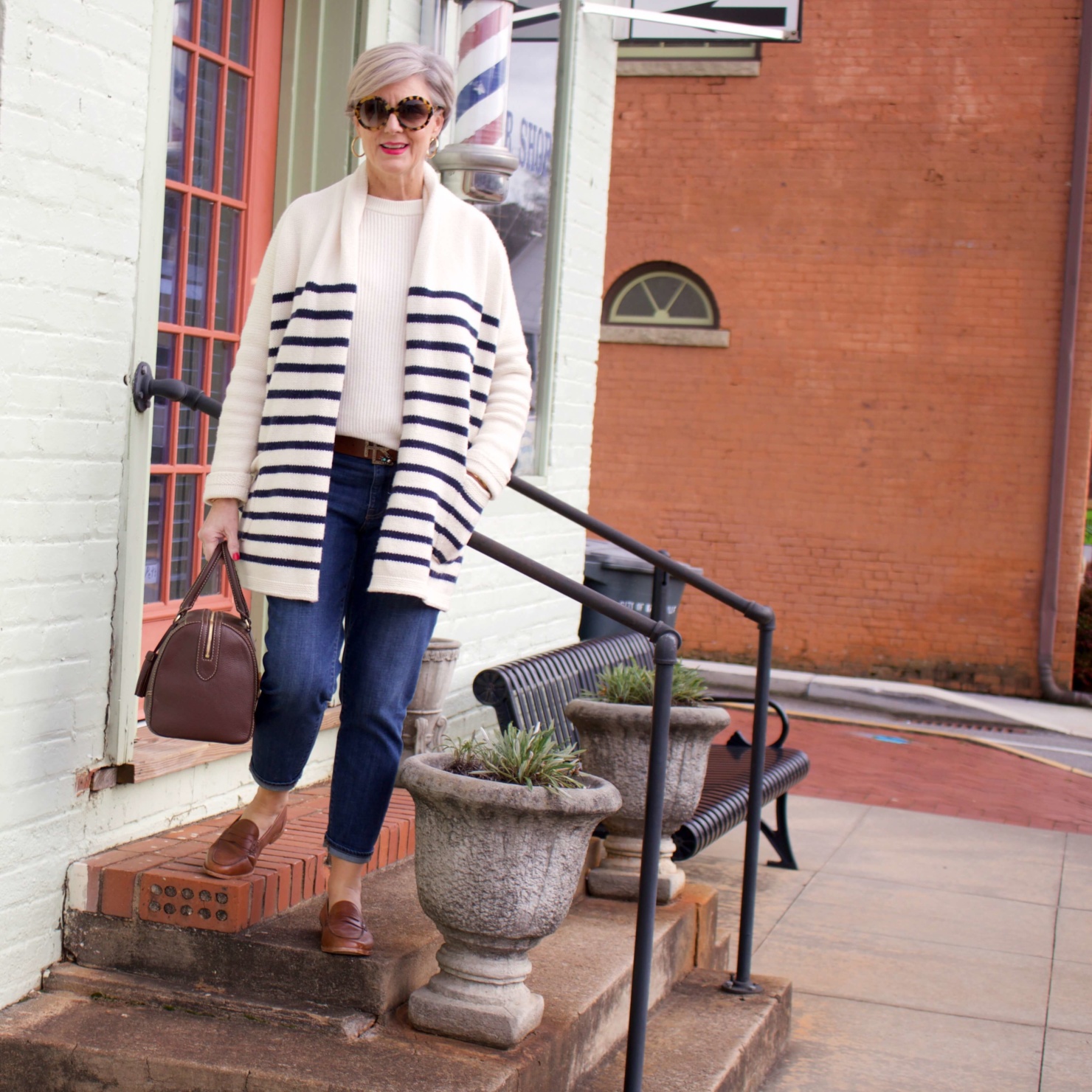beth from Style at a Certain Age wears a J.Crew cozy striped cardigan, Everlane cashmere crewneck, Talbots girlfriend jeans, J.Crew Ryan loafers