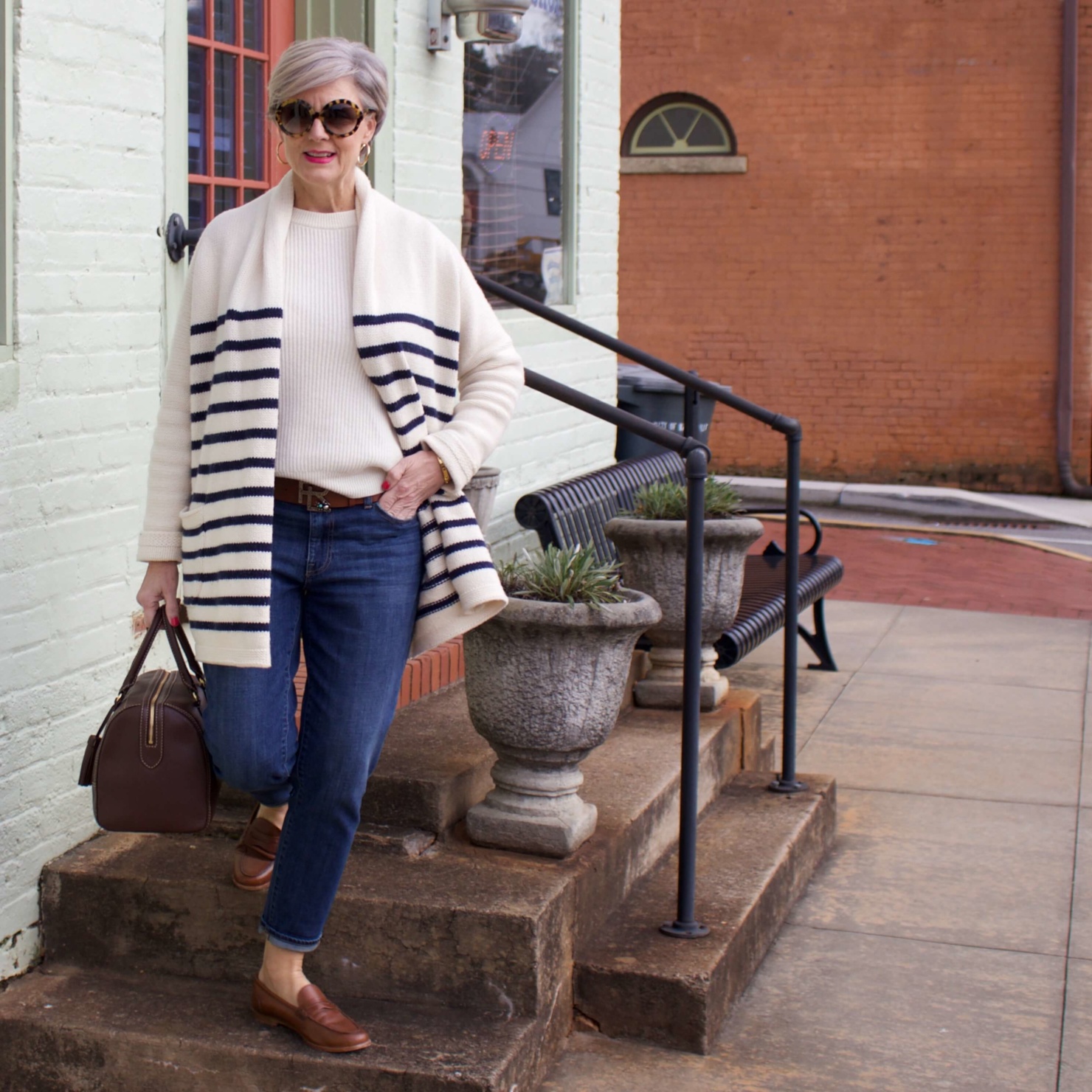 beth from Style at a Certain Age wears a J.Crew cozy striped cardigan, Everlane cashmere crewneck, Talbots girlfriend jeans, J.Crew Ryan loafers