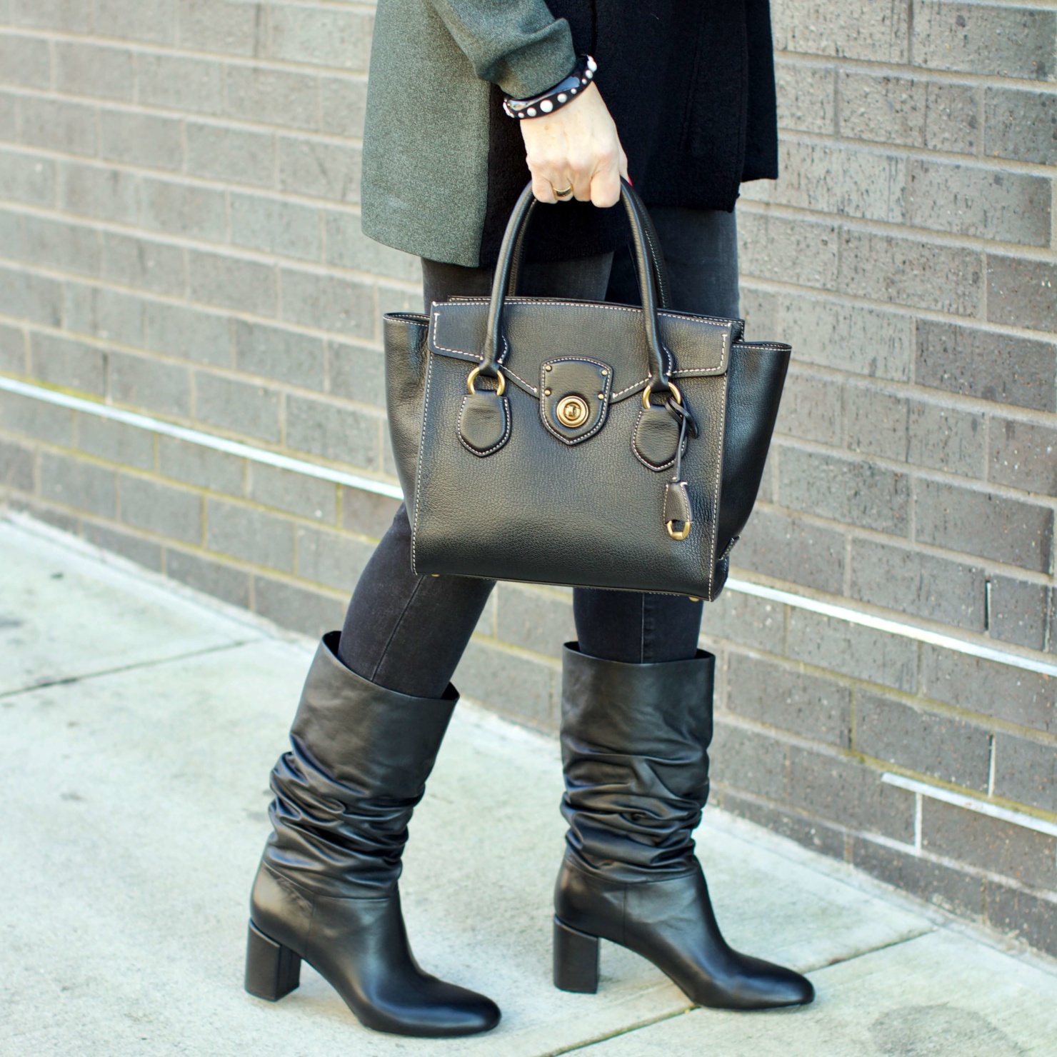 beth from Style at a Certain Age wears an Everlane cashmere waffle square turtleneck, J.Crew Factory black high rise skinny jean, Ann Taylor coatigan, Via Spiga black slouchy boots, Ralph Lauren black handbag, and wool scarf