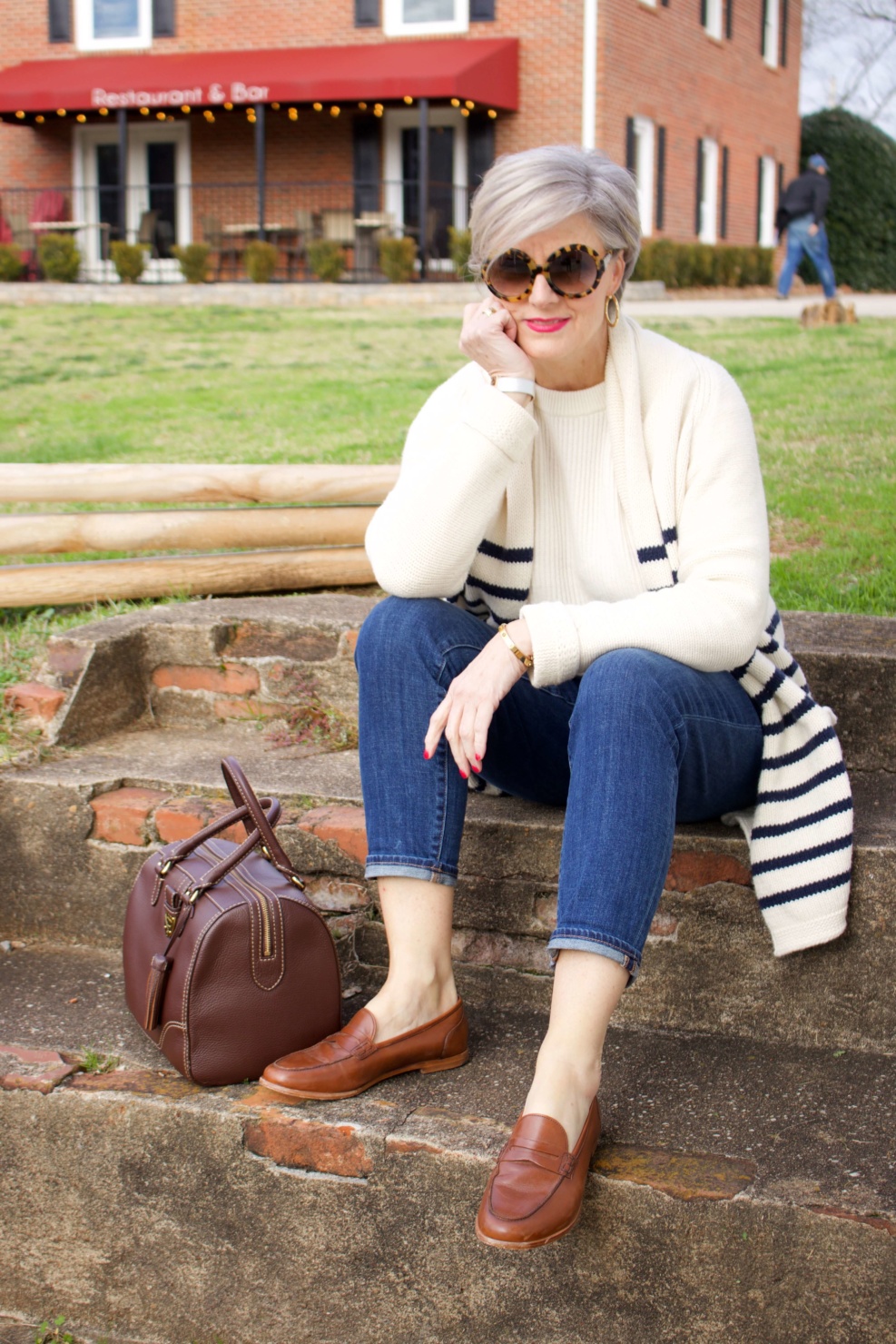 beth from Style at a Certain Age wears a J.Crew cozy striped cardigan, Everlane cashmere crewneck, Talbots girlfriend jeans, J.Crew Ryan loafers