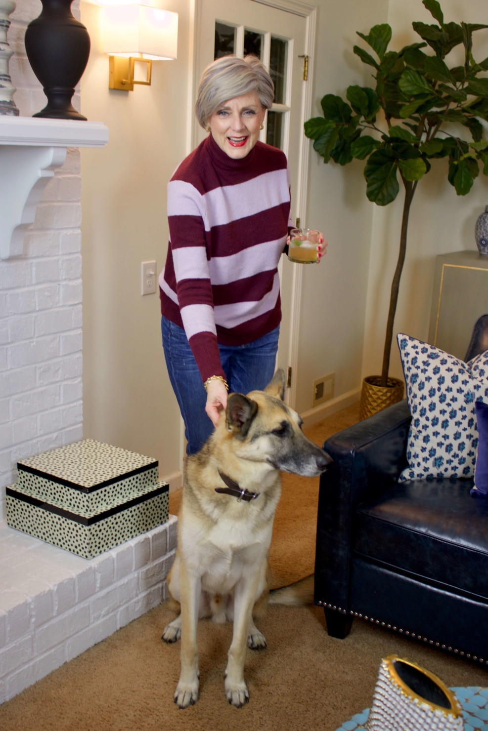 beth from Style at a Certain Age wears a striped turtleneck, J.Crew denim, and Cole Haan suede oxfords