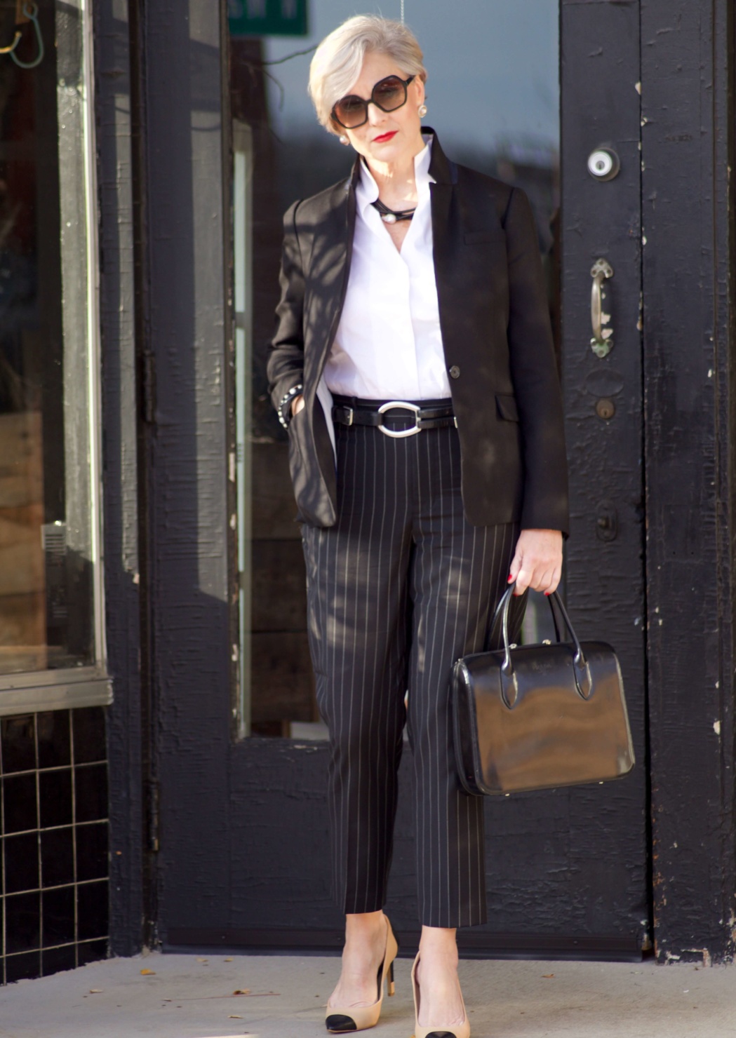 beth from Style at a Certain Age wears Ralph Lauren pinstripe pants, Misook white blouse, J.Crew black blazer, cap toe pumps and black handbag
