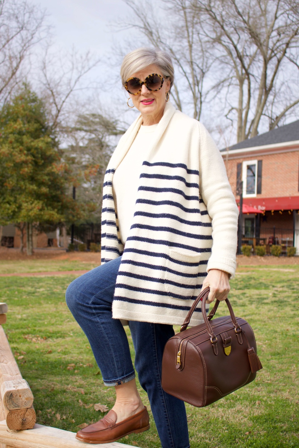 beth from Style at a Certain Age wears a J.Crew cozy striped cardigan, Everlane cashmere crewneck, Talbots girlfriend jeans, J.Crew Ryan loafers