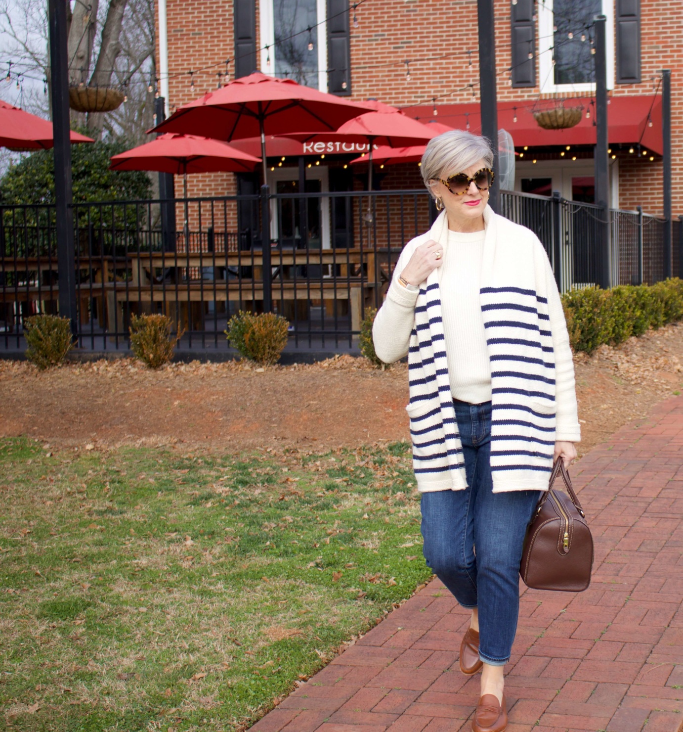beth from Style at a Certain Age wears a J.Crew cozy striped cardigan, Everlane cashmere crewneck, Talbots girlfriend jeans, J.Crew Ryan loafers