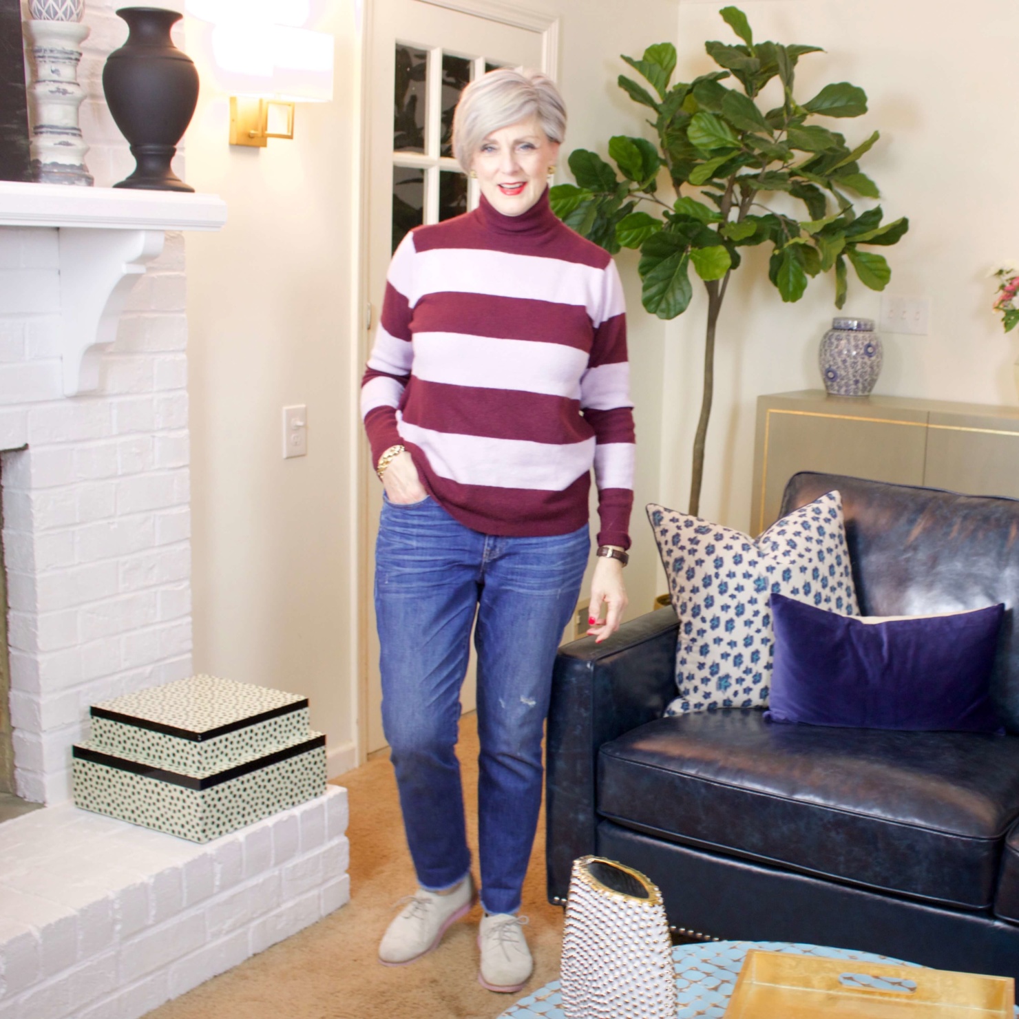 beth from Style at a Certain Age wears a striped turtleneck, J.Crew denim, and Cole Haan suede oxfords