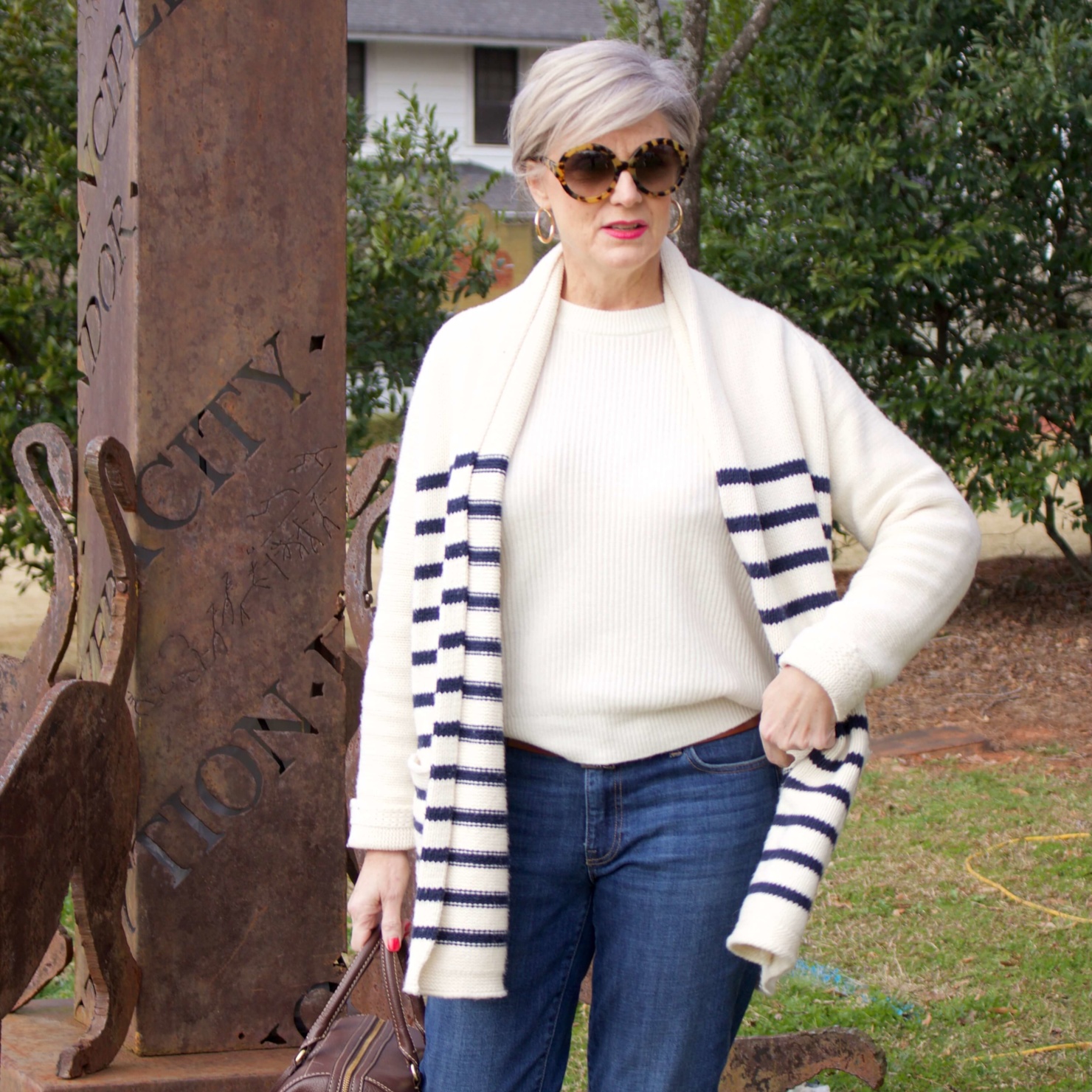 beth from Style at a Certain Age wears a J.Crew cozy striped cardigan, Everlane cashmere crewneck, Talbots girlfriend jeans, J.Crew Ryan loafers