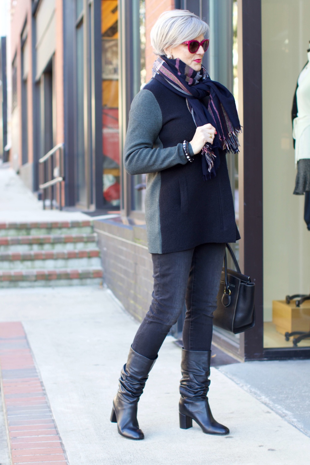 beth from Style at a Certain Age wears an Everlane cashmere waffle square turtleneck, J.Crew Factory black high rise skinny jean, Ann Taylor coatigan, Via Spiga black slouchy boots, Ralph Lauren black handbag, and wool scarf