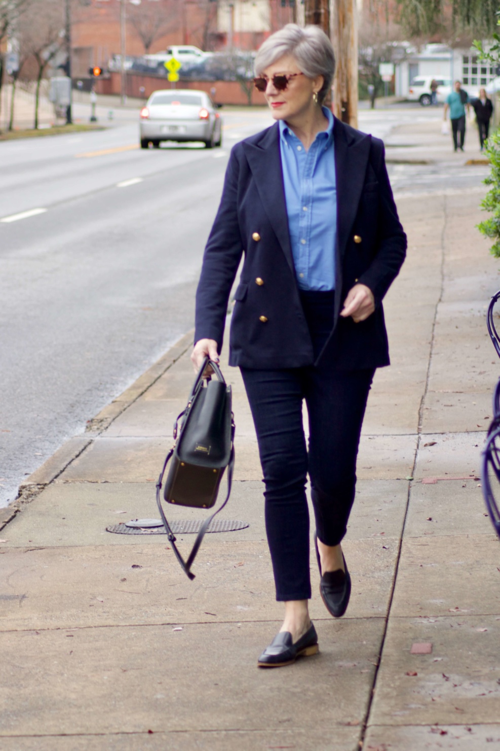 beth from Style at a Certain Age wears a Ralph Lauren navy blue blazer, blue button down, Ann Taylor sailor skinny jeans, and Everlane loafers