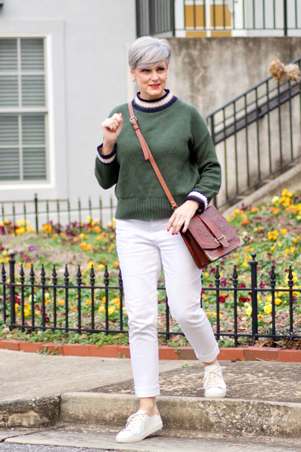 beth from Style at a Certain Age wears a Boden green sweater, white denim and white sneakers