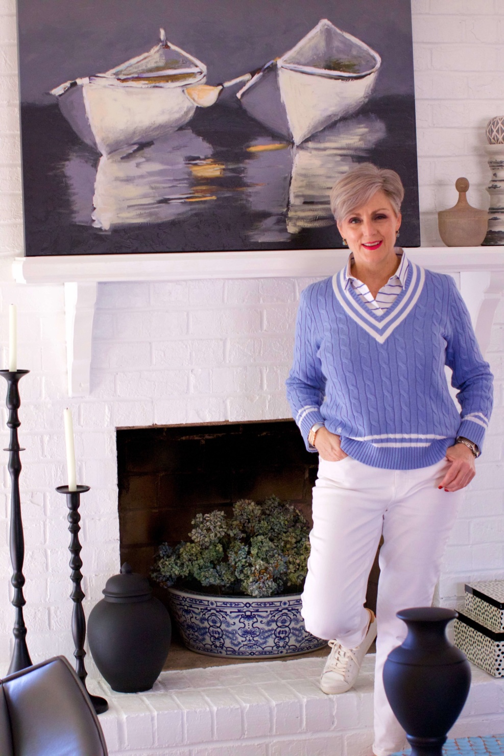 beth from Style at a Certain Age wears a Ralph Lauren cricket sweater, white denim and white tennis shoes
