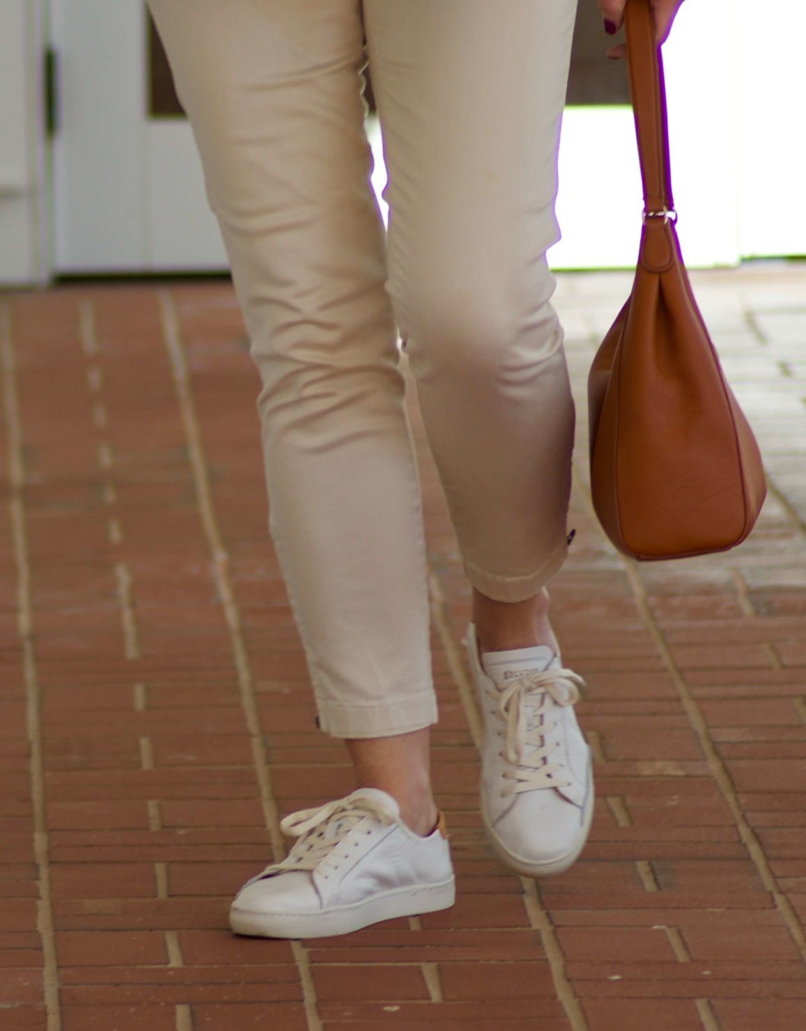 beth from Style at a Certain Age wears J.Crew striped tee, chinos, Ralph Lauren navy blue knit blazer, and white sneakers