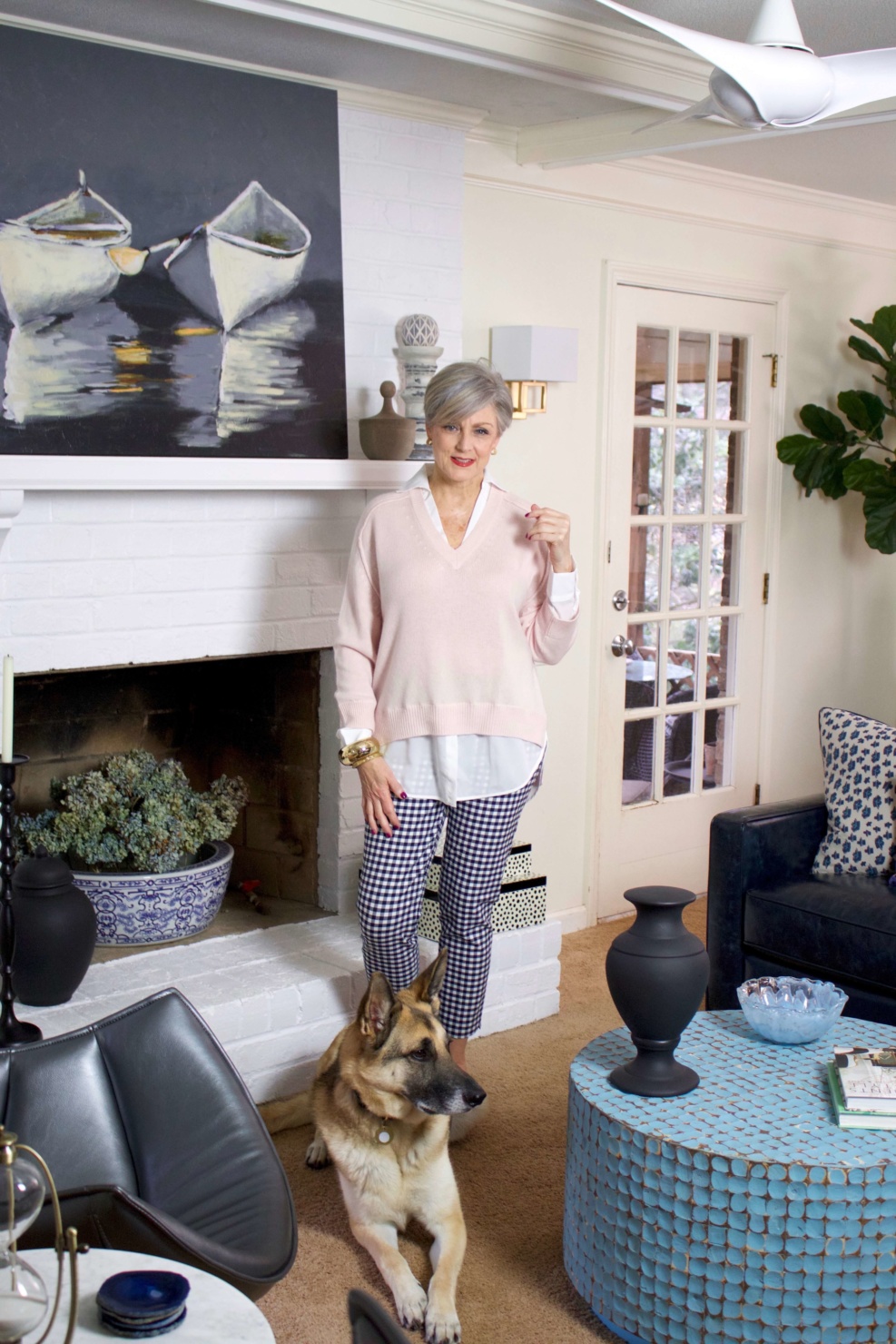 beth from Style at a Certain Age wears a paloma pink sweater with white underlay, gingham pants, and pointy toe flats