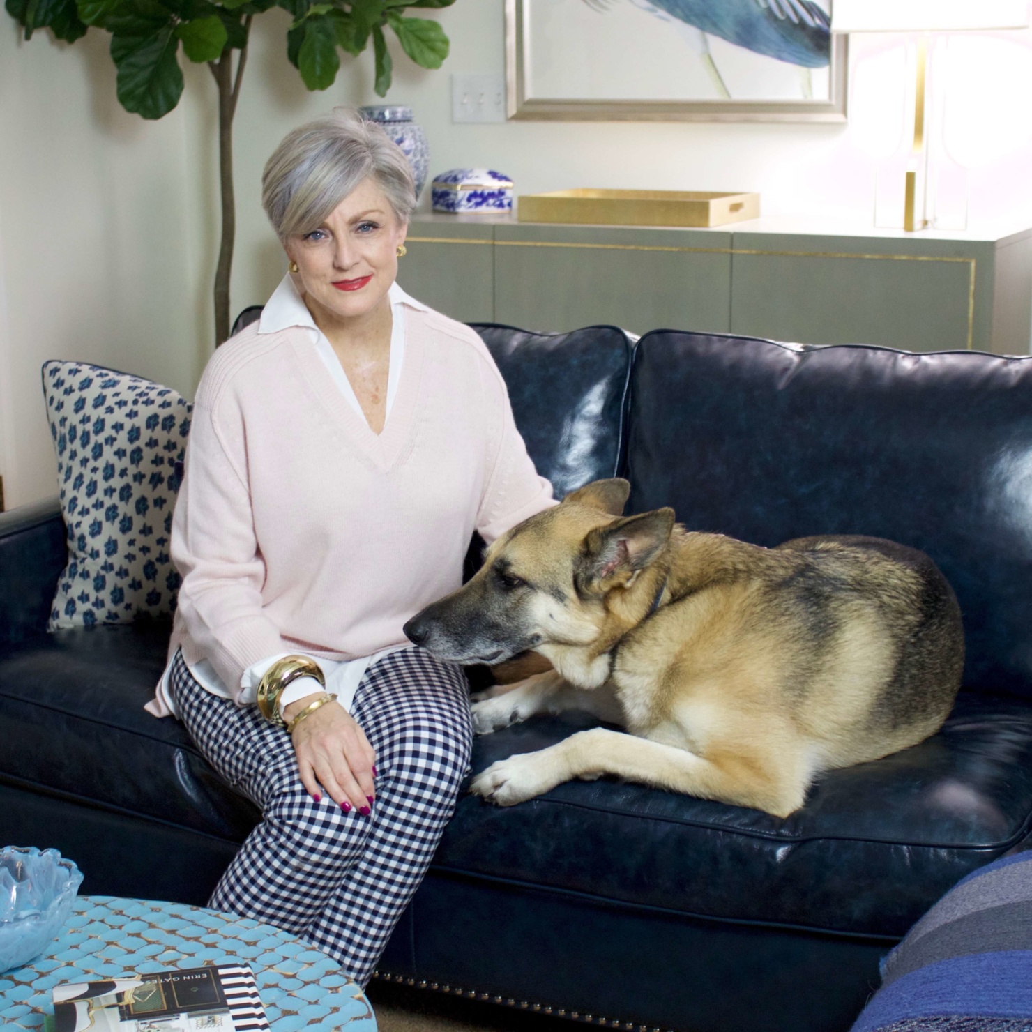 beth from Style at a Certain Age wears a paloma pink sweater with white underlay, gingham pants, and pointy toe flats